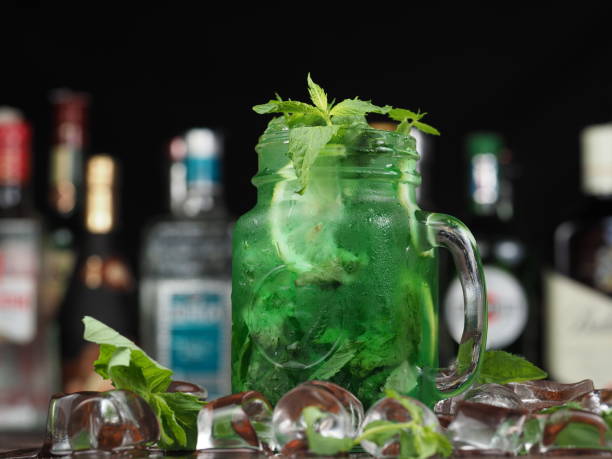 istock Cocktail with mint, lime and ice on a wooden table 1159129666