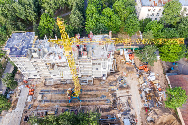 istock construction site with apartment building under construction. aerial view 1159134369