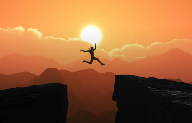 istock Silhouette a businessman jumps over the ravine. Challenge, obstacle, optimism, determination in business concept 1159136540