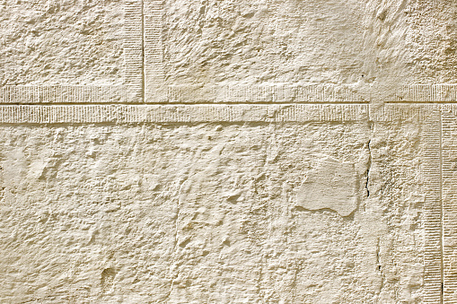 Ancient, abstract, ancient background of beige plaster, cement, gypsum. Copy space