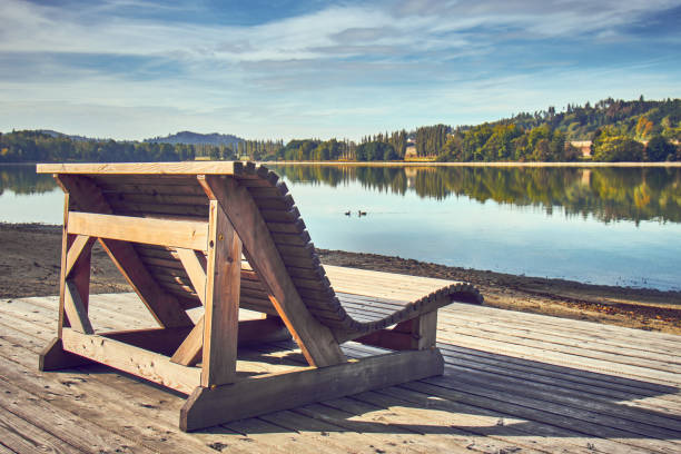 istock Wooden pier stretching into the lake 1159138160