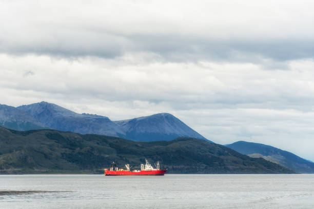 Сargo ship in Beagle Channel, Argentina. Province of Tierra del Fuego. Patagonia Сargo ship in Beagle Channel, Argentina. Province of Tierra del Fuego. Patagonia beagle channel stock pictures, royalty-free photos & images