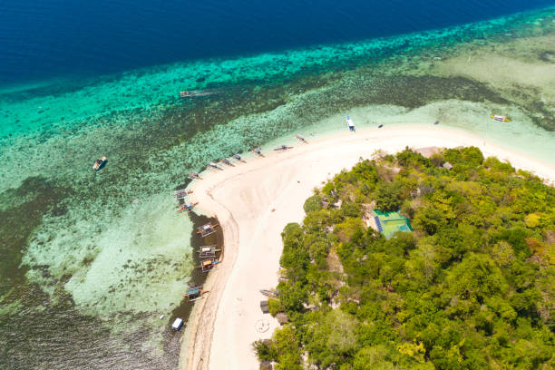 istock Mantigue Island, Philippines.Small round island with a white sandy beach 1159140059