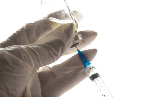 istock Syringe With Vial Isolated On White 1159140344