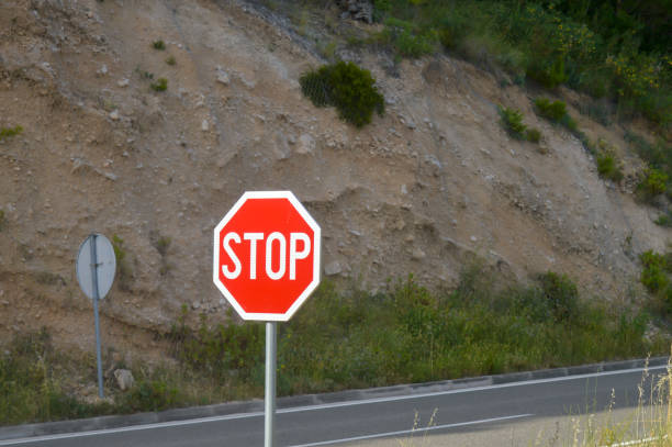 istock Stop sign on Adriatic Sea coast road 1159141996