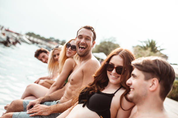 istock happy friends laughing together on the jetty 1159145842