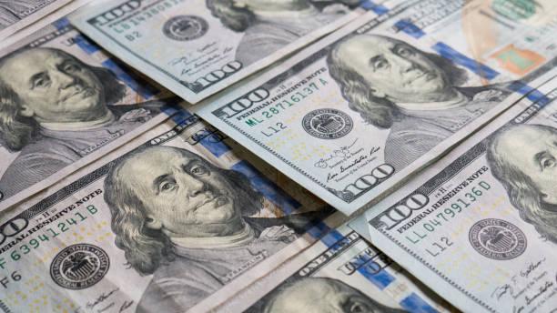 istock Background Of One Hundred American Dollar Banknotes. 1159147428