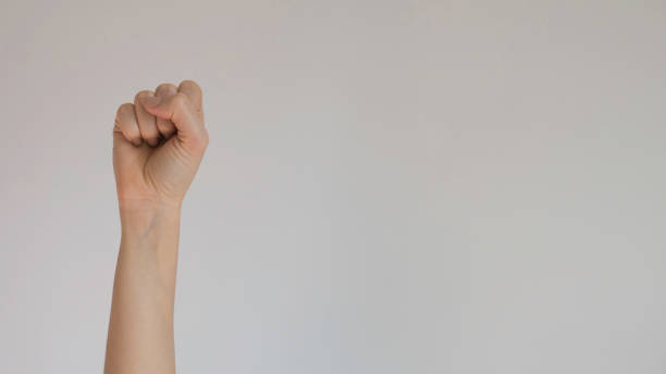 istock Isolated woman's right hand clenched in fist 1159148552