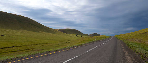 istock Road between the hills. And beautiful cloudy sky. 1159148956