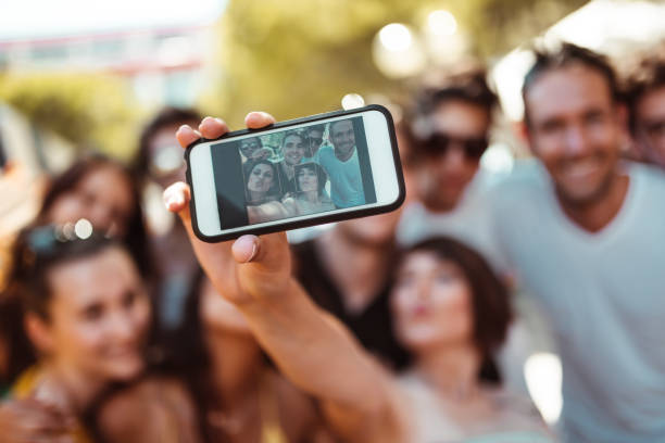 istock friends take a selfie all together 1159148982