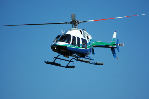 Four rotor, seven passenger helicopter. This helicopter model is also used as an air ambulance. Bell 407.