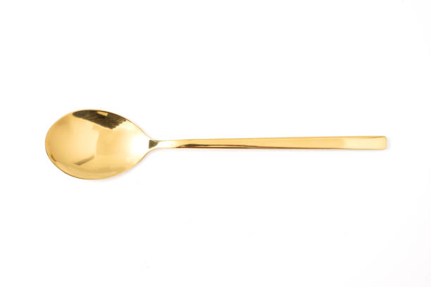 istock golden spoon isolated on a white background 1159152613