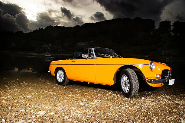 Old retro yellow classic british sports car stock photo