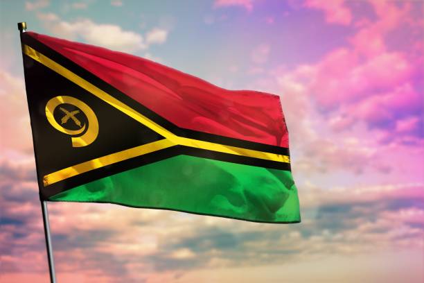istock Fluttering Vanuatu flag on colorful cloudy sky background. Prosperity concept. 1159157999