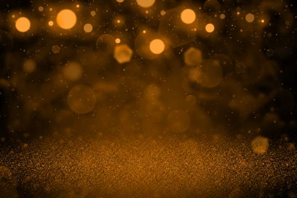 istock orange wonderful glossy glitter lights defocused bokeh abstract background with falling snow flakes fly, holiday mockup texture with blank space for your content 1159158178