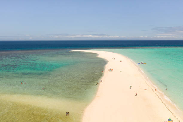 istock Atoll with an island of white sand 1159160198