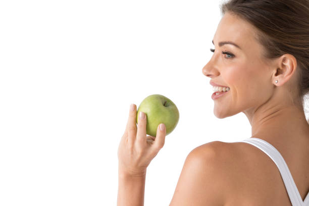 istock Woman with holding green apple 1159160594