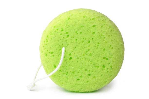 Green bath sponge Green bath sponge on white background porous sponge stock pictures, royalty-free photos & images
