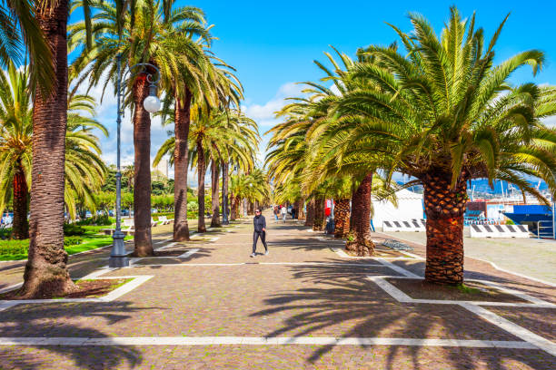LA SPEZIA, ITALY - APRIL 07, 2019: Promenade in the public park near the La Spezia city port, Liguria region of Italy
