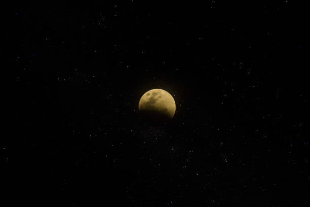 istock super blue blood lunar eclipse in the dark night. 1159163194