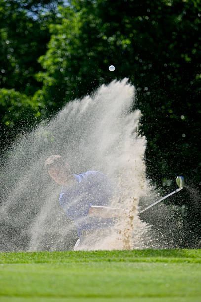 istock olfer chipping out of Sand Trap 115916329