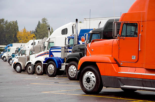 istock A group of semi trucks parked in a row 115916511