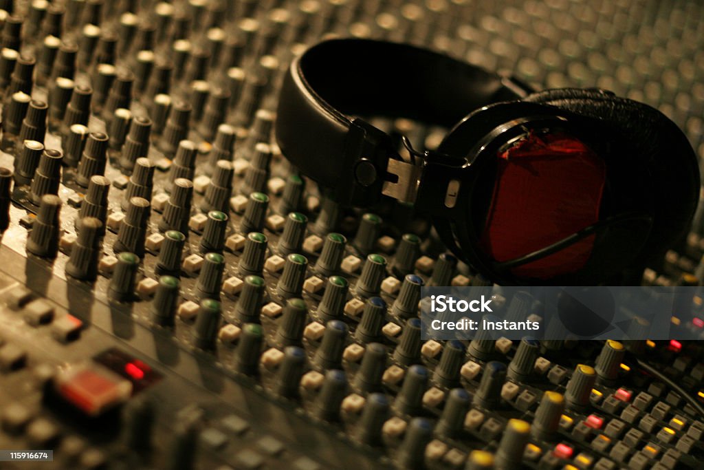 Sound Headphones on a sound mixer. Balance Stock Photo