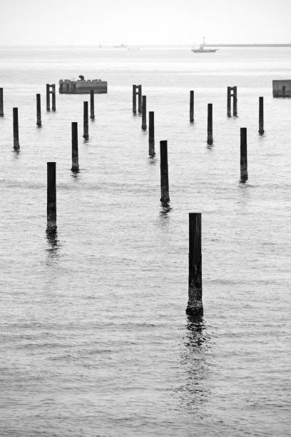 istock Fantastic scenery with many piles in the sea 1159167271