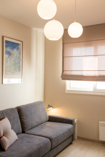 istock Small living room with sofa and Roman blinds. 1159168890