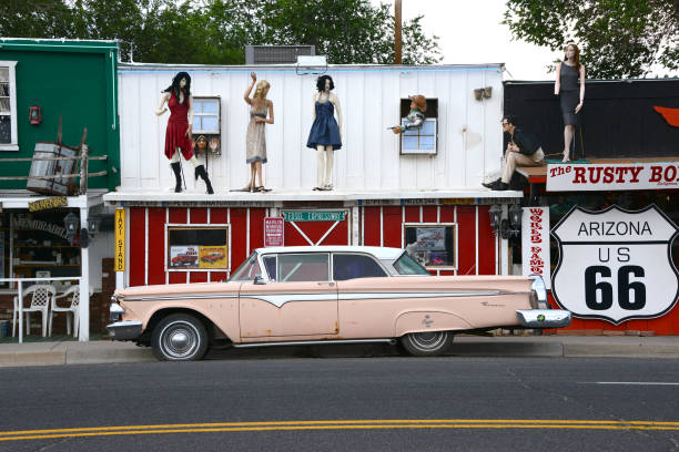 Seligman, Arizona, 07/20/2013\nold car in front of western style facade in Seligman, Arizona