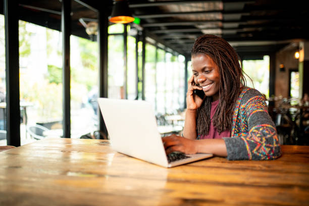 istock Busy African woman working from the bar. 1159170702
