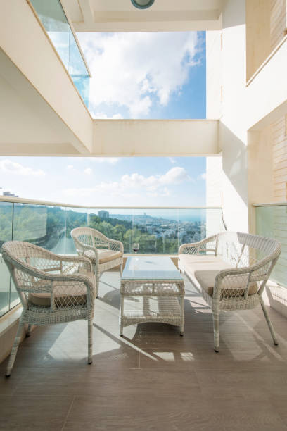istock Sunlit balcony in a modern residential building. 1159170736