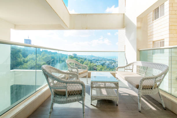 istock Sunlit balcony in a modern residential building. 1159171605
