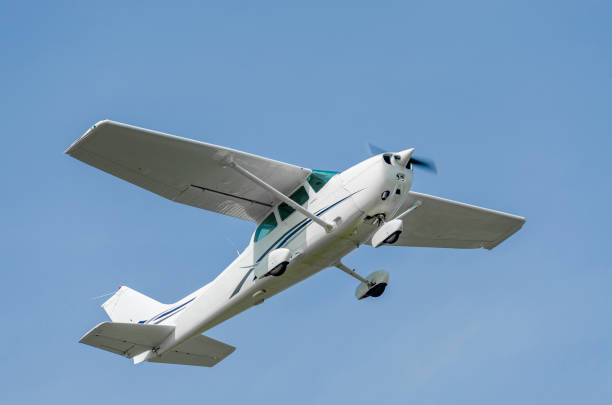istock Single-engine sport airplane in a clear blue sky 1159171745