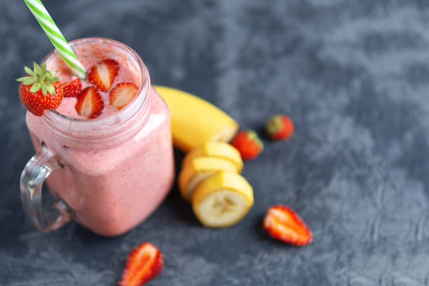 istock Strawberry smoothie or milkshake on the table with copyspace. Summer red Breakfast 1159171974