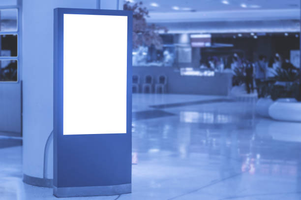 istock blank billboard white screen LED vertical advertising banner board indoor in subway station ad interior public hall. 1159172198