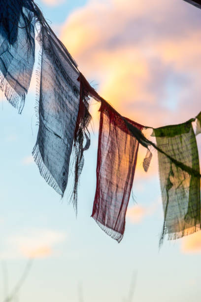 istock Colorful Tibetan prayer flag in the wind, blue sky 1159172224