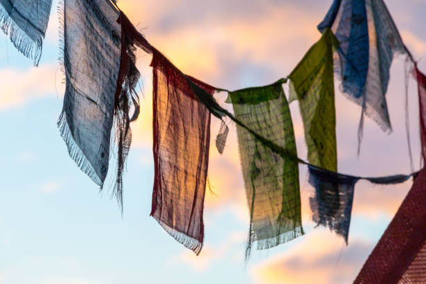 istock Colorful Tibetan prayer flag in the wind, blue sky 1159172949