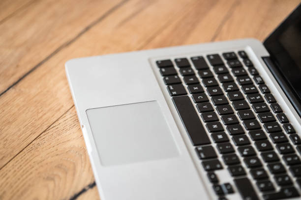 istock Laptop on a rustic wooden desk, home office 1159173366