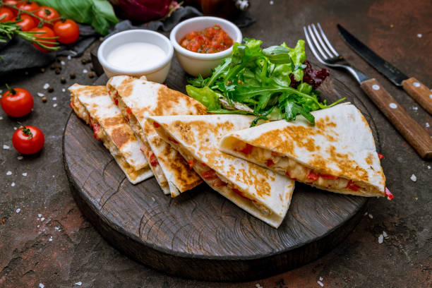 Quesadilla with chicken and sauces stock photo