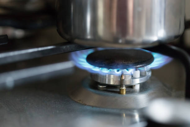 istock Cooking with gas, water pot in kitchen 1159174345