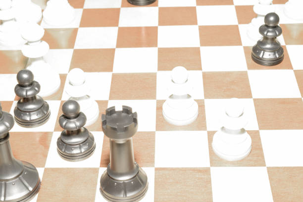 istock Wooden chess board and white pieces like a skill concept 1159174455