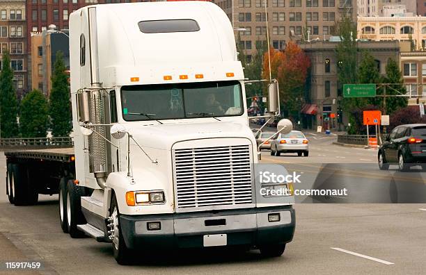 Flatbed Semi Truck On A City Street Stock Photo - Download Image Now - Struggle, Trucking, Cargo Container