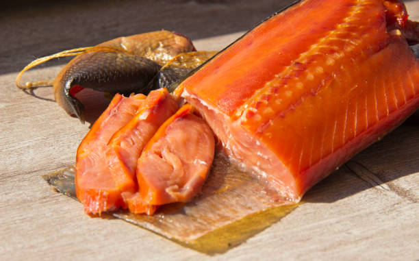 istock delicious smoked fish on wooden background 1159175246