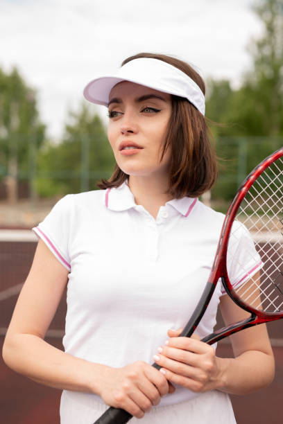 istock Pretty young brunette tennis player with racket 1159175681