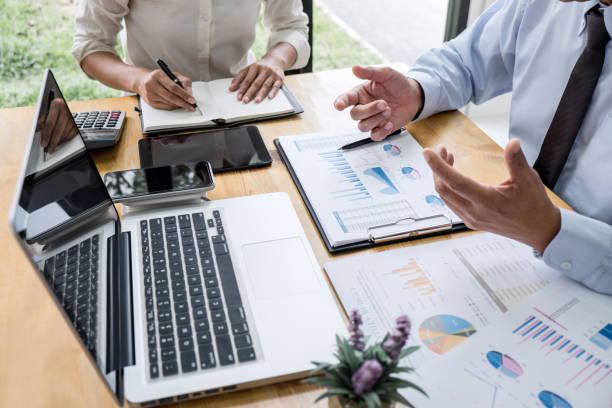 istock Two business team manager having a discussing with new project success financial statistics, Partner meeting professional investor working start up project for both company with document 1159177808