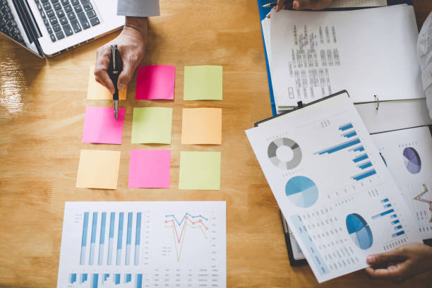 istock Co working conference, Business team meeting present discussing working analysis with financial data and marketing growth report graph in team, Finance, accounting, investment 1159177886