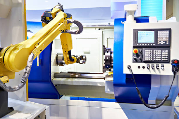 istock Robotic arm and cnc lathe 1159178066