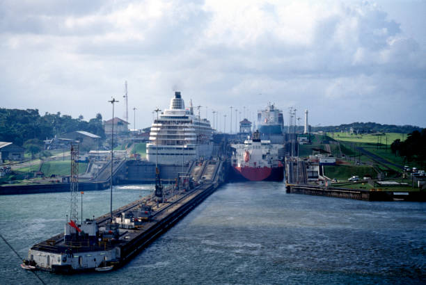 Cargo ship navigating the Gaillard Cut (Culebra Cut)in the Panama Canal and passing under the Centenary Bridge.