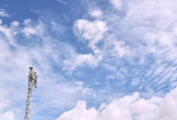 istock football stadium lamp structure on sky background 1159179402
